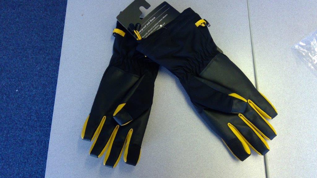 504844356
A BLACK AND YELLOW WOVEN GLOVE, CONSTRUCTED FROM VARIOUS MATERIALS AS FOLLOWS:
A BLACK PANEL (FORMING A GRIP) ON THE PALM AND FINGER FRONTS  AND OVER THE TIPS OF THE FINGERS, WHICH IS  CONSTRUCTED FROM NONWOVEN NYLON TEXTILE FIBRES COATED WITH A NON-CELLULAR POLYURETHANE PLASTIC ON ONE SURFACE. IN BETWEEN THE FINGERS (YELLOW IN COLOUR) IS CONSTRUCTED OF THE SAME MATERIALS AS THE PALM BUT WITH A GRAIN DESIGN TO LOOK LIKE LEATHER.
THE BODY AND BACK OF THE GLOVE IS  WOVEN NYLON WITH A WOVEN POLYESTER LINING.
THE GLOVE IS AN EXTENDED LENGTH REACHING DOWN PAST THE WRIST.   
ELASTICATED BLACK CUFF AND YELLOW DRAWCORD CLOSURE. BRANDING ON FRONT OF GLOVES IN WHITE FONT, THE WOVEN FABRIC PROVIDES UV50+ PROTECTION AND IS WATER REPELLENT.
