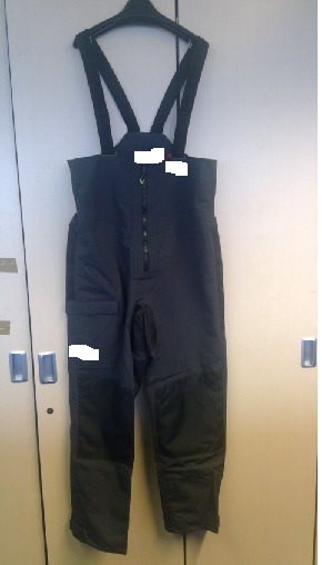 WOVEN SALOPETTE STYLE GARMENT. MADE FROM EXPLORE(R) 2- LAYER WATERPROOF AND BREATHABLE FABRIC XPEL(R) WITH STAIN REPELLANT TECHNOLGY.
IT HAS A FRONT OPENING THAT IS FASTENED WITH A ZIP AND HAS AN INTERNAL GUSSET FOR WET WEATHER PROTECTION. 
IT HAS ADJUSTABLE BRACES AND A SEMI ELASTICATED WAIST.
IT IS GREY IN COLOUR WITH REINFORCED SEAT AND KNEES IN BLACK.
THE COMPANY LOGO IS ON BOTH THE FRONT AND BACK OF THE GARMENT. 
THE ITEM IS MADE FROM 100% NYLON MAIN LINING: 100% POLYESTER MESH: 100% POLYESTER FLEECE LINING
