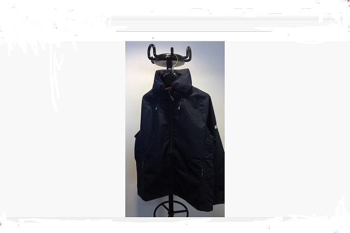 HOODED LIGHT JACKET. 
THE OUTER OF THE JACKET IS A WOVEN POLYESTER WITH A WATERPROOF FINISH AND NYLON LINING. 
IT HAS A FRONT ZIPPER AND A REFLECTIVE DETAIL FOR VISIBILITY.
IT HAS A ROLLAWAY HOOD WITH A TWO-WAY ADJUSTMENT AND TAPED SEAMS.
HAS ADJUSTABLE CUFFS LINED WITH A SOFT POLYURETHANE (PU) MATERIAL AND AN INTERNAL POCKET.
THERE ARE NO FASTENINGS TO DISTINGUISH IF GARMENT IS DESIGNED FOR WOMEN THEREFORE IT IS CLASSIFIED AS UNISEX.
THE INNER SURFACE OF THE GARMENT IS SMOOTH AND SHINY AND THERE ARE NO FIBRES VISIBLE TO THE NAKED EYE. 
THE OUTER TEXTILE FRAYS HOWEVER THE FIBRES CANNOT BE SEPARATED DUE TO THE COATING ON THE BACK.