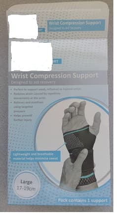 WRIST COMPRESSION SUPPORT MADE FROM KNITTED NYLON AND SPANDEX. THE PRODUCT HAS A HOLE FOR THE THUMB TO GO THROUGH AND A WRAP AROUND STRAP TO ADJUST THE SIZE. THE SUPPORT IS TO PROVIDE COMPRESSIVE SUPPORT TO AID RECOVERY FROM INJURY. IT IS BLACK AND BLUE IN COLOUR WITH THE COMPANY LOGO AT THE TOP OF THE SUPPORT. IT HAS INTEGRATED SILICONE GEL CUSHION WHICH SUPPORTS THE WRIST JOINT. 
PACKAGED IN A BLUE AND WHITE CARDBOARD BOX.