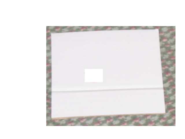 A SHEET OF CORRUGATED PAPERBOARD MEASURING APPROX 13 X 13 CM WHICH IS USED AS A DIVIDER IN THE PACKAGING OF MP3 PLAYERS