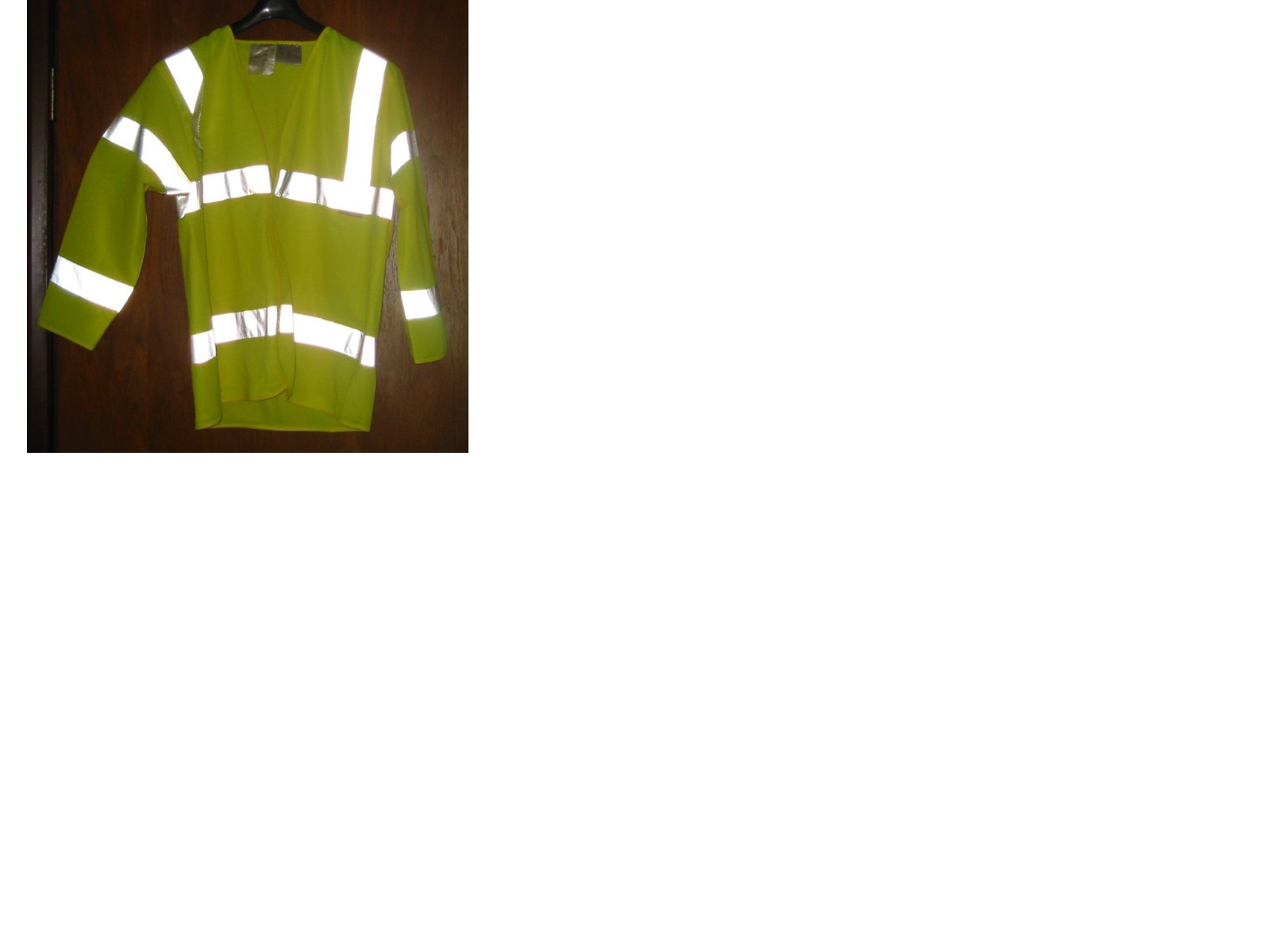 A MANS JACKET, KNITTED, COMPOSED OF 100% POLYESTER, WITH COMPLETE FRONT OPENING, CLOSING LEFT OVER RIGHT WITH A VELCRO FASTENING, DESIGNED TO COVER THE UPPER PART OF THE BODY REACHING DOWN BELOW THE WAIST, WITH A V-NECK, WITHOUT COLLAR AND WITH BINDING ON THE NECK, FRONT OPENING, BASE AND SLEEVE-ENDS.  THE FABRIC OF THE GARMENT IS FLUORESCENT, WITH REFLECTIVE STRIPS SEWN ON VERTICALLY AND HORIZONTALLY WITH A BRAND NAME TAG STITCHED ON THE LEFT SIDE BELOW CHEST LEVEL.