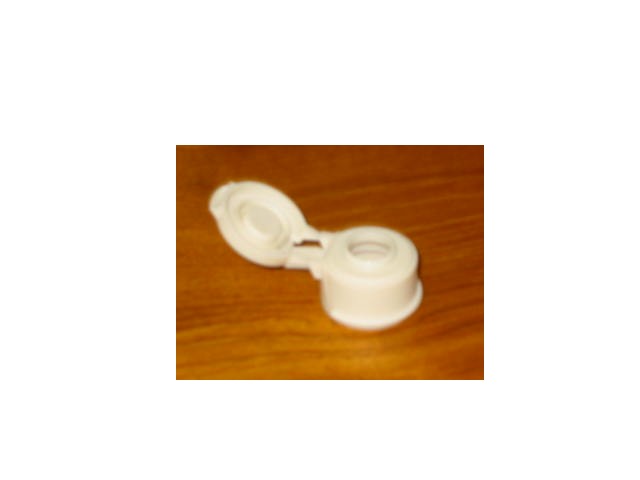 A CLOSURE OF PLASTIC, A DROPPER TIP, 13MM IN DIAMETER,  USED AS PART OF FINISHED DIAGNOSTIC KIT.