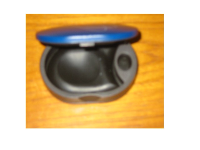 A CONTAINER OF PLASTIC, SPECIALLY SHAPED TO HOLD HEARING AIDS, WITH A HINGED LID, WITH A CLASP FASTENING AND RUBBER CUSHIONING INSIDE.