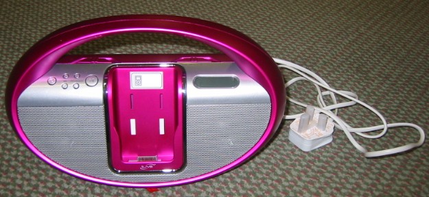 PORTABLE DOCK FOR AN IPOD WITH RADIO AND ALARM CLOCK. THIS IS CAPABLE OF OPERATING BY BATTERY. THE IPOD FITS INTO A DOCK IN THE CENTRE OF THIS DEVICE, SOUNDS FROM THE IPOD CAN THEN BE AMPLIFIED BY SPEAKERS ON THE UNIT. IT IS ALSO CAPABLE OF CHARGING THE IPOD.