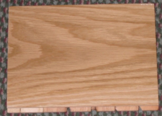 PLYWOOD CONSISTING OF THREE PLIES; THE OUTER PLY IS OAK MEASURING 2.6 MM, THE MIDDLE PLY IS HEVEA MEASURING 9 MM AND THE BOTTOM PLY IS 2 MM OF OTHER SOLID WOOD;  TONGUED AND GROOVED AND USED AS TIMBER FLOORING.