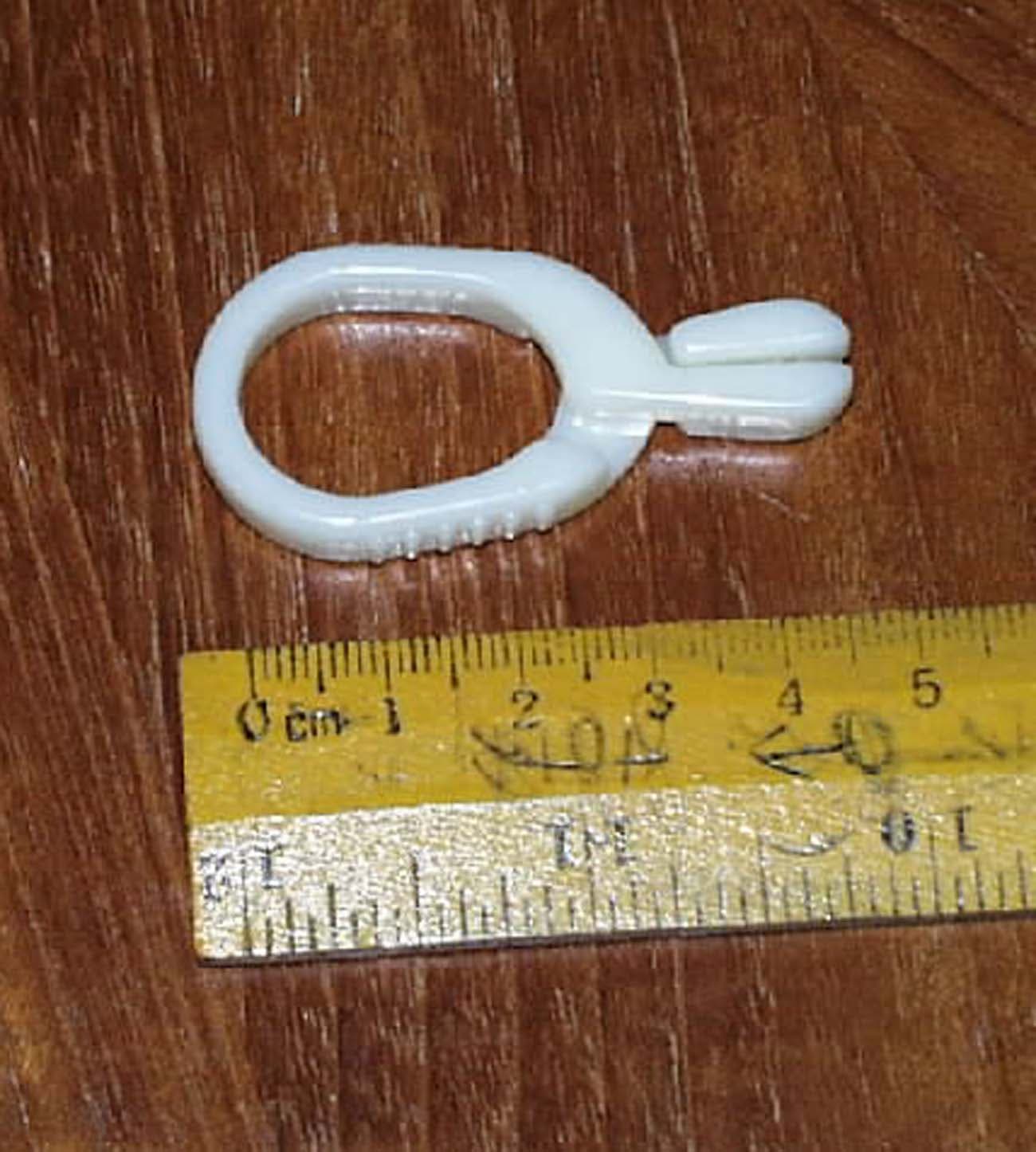 THIS PRODUCT IS A GUIDEWIRE CLIP. IT IS SPECIFICALLY DESIGNED FOR USE WITH A STAINLESS STEEL SURGICAL GUIDEWIRE. IT ATTACHES THE GUIDEWIRE TO A SURGICAL DRAPE TO HOLD IT IN POSITION.