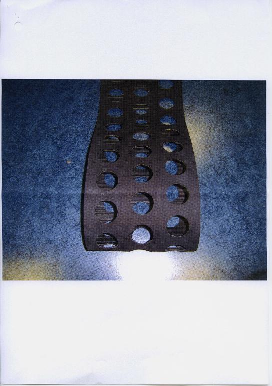 A TRANSFER BELT WHICH ACTS AS A TYPE OF CONVEYOR BELT THAT LOCATES AND MOVES A PARTICULAR PRODUCT THROUGH VARIOUS STAGES OF A MANUFACTURING PROCESS. THE BELT IS CONTINUOUS. IT'S COMPOSITION IS RUBBER REINFORCED WITH A TEXTILE BRAID.