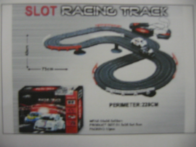 TOY CAR RACING SET. THIS CONSISTS OF BATTERY OPERATED CARS AND RACETRACK. THESE ARE MADE FROM PLASTIC.