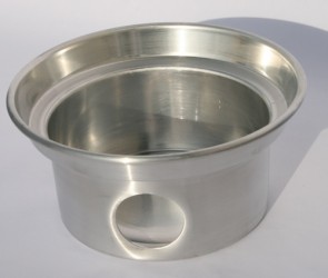 STAINLESS STEEL FIRE BASE FOR USE WITH A CAMPING KETTLE. THIS IS EFFECTIVELY A STEEL BOWL WITH A CIRCULAR AIR HOLE IN THE SIDE. A SMALL WOOD FIRE IS CREATED IN THIS BOWL AND THEN A CAMPING KETTLE IS PLACED GENTLY ON TOP. THIS BOWL KEEPS THE FIRE SAFELY CONTAINED AND THE AIR HOLE IN THE SIDE LETS AIR IN FOR COMBUSTION IN THE BOWL (FIRE-BASE) AND THE CHIMNEY OF A KETTLE. FOR OUTDOOR USE ONLY.