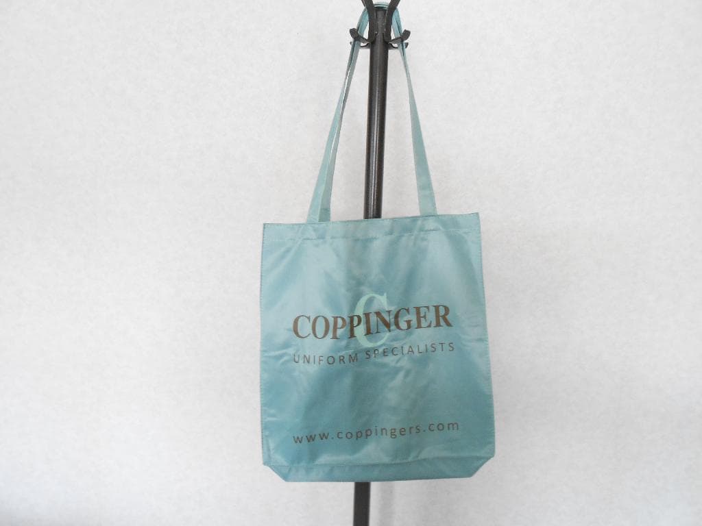 TEXTILE BAGS WITH OUTER COATING OF POLYESTER