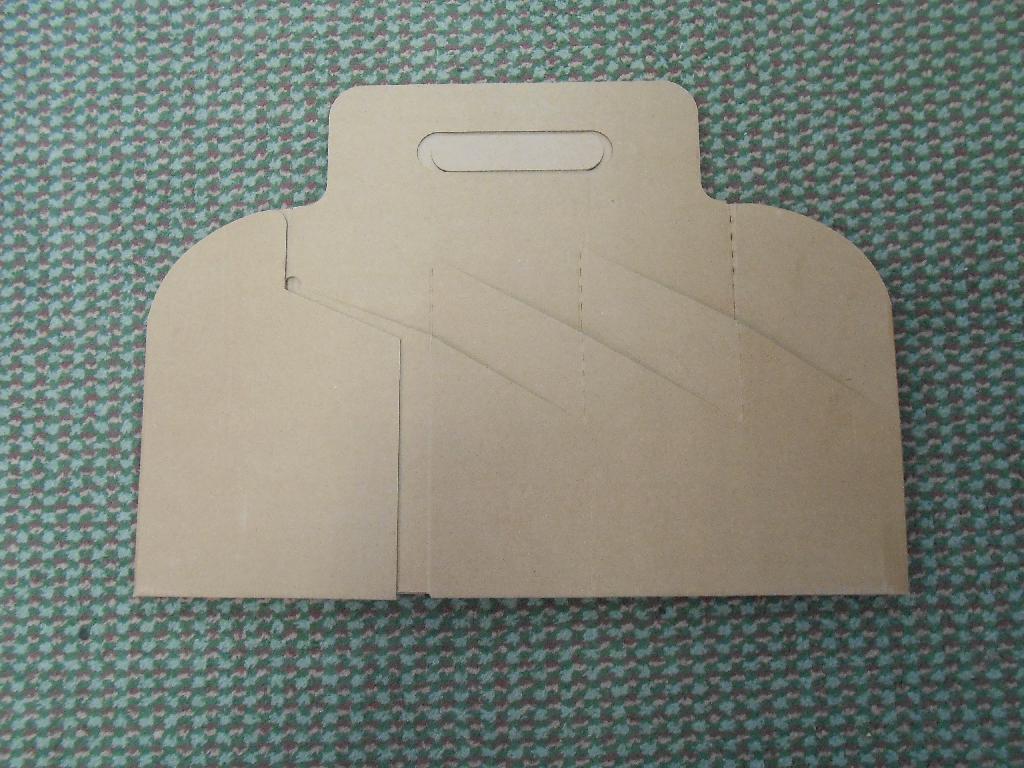 WINE BOTTLE CARRIER CASE/BOX MADE OF CORRUGATED CARDBOARD. IT COMES IN COLLAPSED/FOLDABLE FORM.