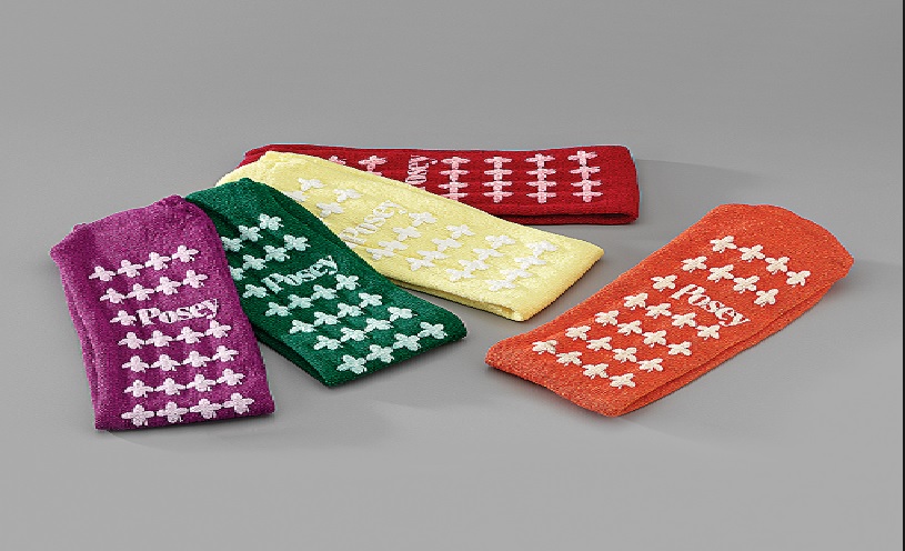MALE/FEMALE NON SLIP SOCKS. KNITTED, 80% COTTON; 20% OTHER SYNTHETIC TEXTILES. SOFT TERRY CLOTH WITH SKID RESISTANT RUBBER TREADING ON BOTH SIDES.