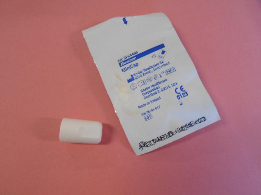 PLASTIC DISCONNECT CAP FOR PERITONEAL DIALYSIS AND CONTAINS PROVIDINE IODINE INTENDED TO PROTECT THE FEMALE LUER CONNECTOR OF THE BAXTER TRANSFER SET.  THE CAP IS A CLASS 11A DISPOSABLE MEDICAL DEVICE AND CERTIFIED WITH CERT NO C1 14 10 62680 097