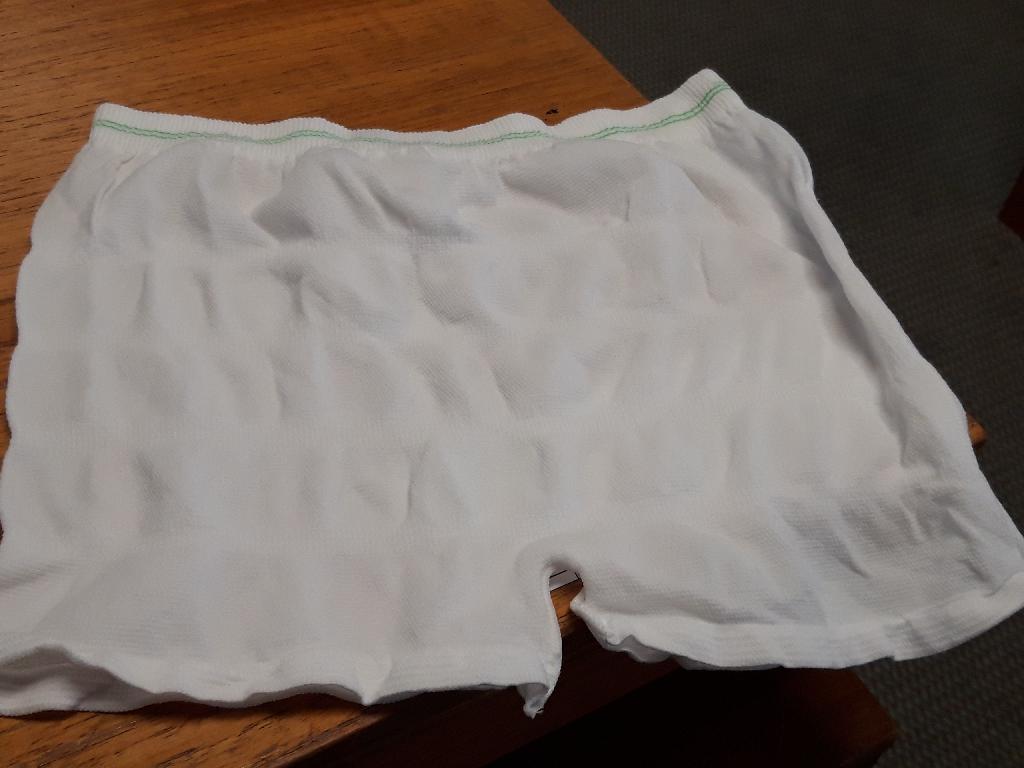 "UNISEX REUSABLE INCONTINENCE FIXATION PANTS"
THE ARTICLE IS DESIGNED AS PART OF THE TWO PIECE INCONTINENCE MANAGEMENT SYSTEM TO EFFECTIVELY MANAGE SERIOUS CHRONIC INCONTINENCE PROBLEMS AND THEREFORE SPECIFICALLY DESIGNED TO BENEFIT HEALTH CARE INSTITUTIONS AND THE CHRONICALLY INCONTINENT PATIENTS THEY SERVE
THE INCONTINENCE PANTS ARE SOLD IN TWO PARTS, THE "PANTS AND THE PAD" AND BOTH ARE DELIVERED AND SOLD SEPARATELY, HOWEVER BOTH ARE NEEDED TO BE AN EFFECTIVE PRODUCT
THIS CLASSIFICATION IS FOR ONE PART OF THE SYSTEM THE REUSABLE INCONTINENCE FIXATION PANTS
THE FIXATION PANTS HAVE A SPECIALLY KNITTED AND CONSTRUCTED WAISTBAND TO PROVIDE BETTER FIXATION TO THE PATIENT.  THE PRODUCT IS DESIGNED AS SEAMLESS AND WHEN STRETCHED IS ALMOST TRANSPARENT, SO IT WILL NOT INTERFERE WITH THE PATIENT'S REGULAR UNDERWEAR OR OUTER GARMENTS.  THEY ARE DESIGNED TO BE WASHABLE, BREATHABLE.