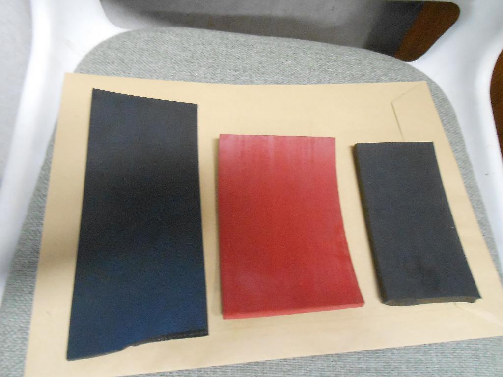 NON CELLULAR VULCANISED RUBBER IN SHEETS AND ROLLS AND ALSO STRIPS (WHICH ARE SUPPLIED IN ROLL FORM) IN COLOURS OF BLACK AND RED.