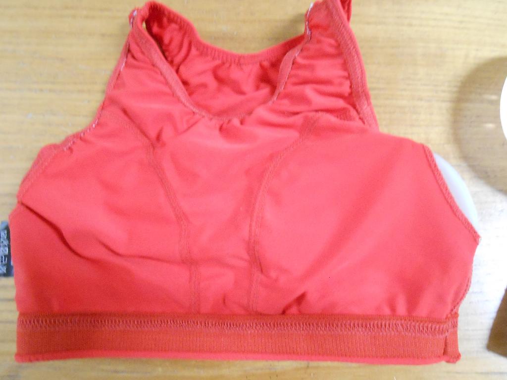 LADIES SPORTS BRA PROTECTORS/ WOMEN’S CHEST GUARDS.
IT COMES WITH TWO HARD PLASTIC INSERTABLE CUP SHELLS TO PROTECT THE BREASTS. WEARING THEM REDUCES PENETRATION INTO THE BREAST WHICH WOULD CAUSE SERIOUS INJURY. IT IS WITHOUT AN OPENING AND WITHOUT A CLOSURE. IT HAS NON-ADJUSTABLE STRAPS. IT IS SLEEVELESS AND REACHES TO JUST BELOW THE BREASTS WHERE IT HAS AN ELASTICATED SUPPORT BAND. LADIES USE THEM FOR CONTACT SPORTS LIKE KARATE, BOXING, GAELIC SPORTS, FENCING AND MANY OTHER SPORTS.
THE PRODUCT HAS INTERNAL STITCHING WHICH DEFINES THE SHAPE OF THE BUST.
MADE FROM 88% POLYESTER AND 12% SPANDEX WRAP KNIT FABRIC.