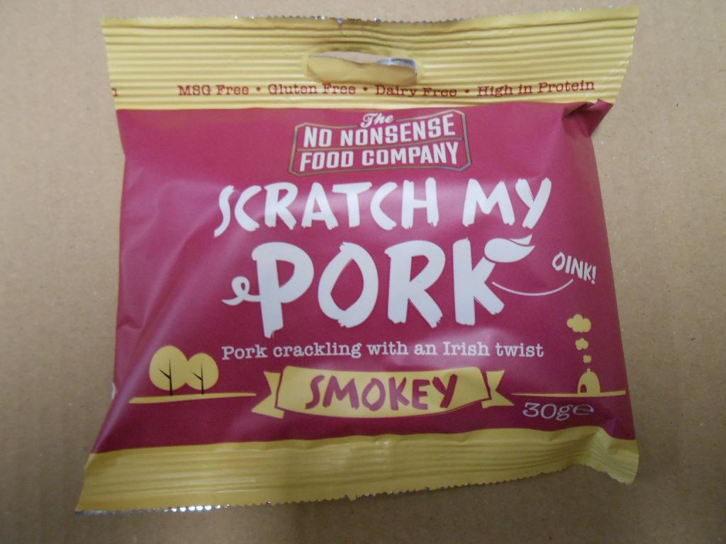 SMOKEY FLAVOUR PORK CRACKLING.
A NATURAL PRODUCT MADE FROM PORK RIND, COOKED AT SPECIFIC TEMPERATURES WITH A BLEND OF SPICES, RESULTING IN A CRUNCHY AND CRISPY SNACK. PACKED AND SEALED IN A 30G FOIL BAG.
INGREDIENTS: IRISH PORK PIG RIND (95%),SMOKEY BBQ GLAZE(5%)(SUGAR, MALTODEXTRIN, SALT, MODIFIED FOOD STARCH (WAXY MAIZE STARCH, TAPIOCA), FLAVOURINGS(SOYA), ACIDITY REGULATOR: CITRIC ACID, COLOURS: CARAMEL (SULPHITES) AND PAPRIKA, TOMATO, THICKENER:XANTHAN GUM, SMOKE FLAVOURING(0.6%), GARLIC, ONION, SPICES, CAPSICUM EXTRACT).