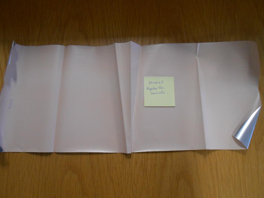 POLYESTER FILM LAMINATE (TAN)
OUR REF: 25F002A