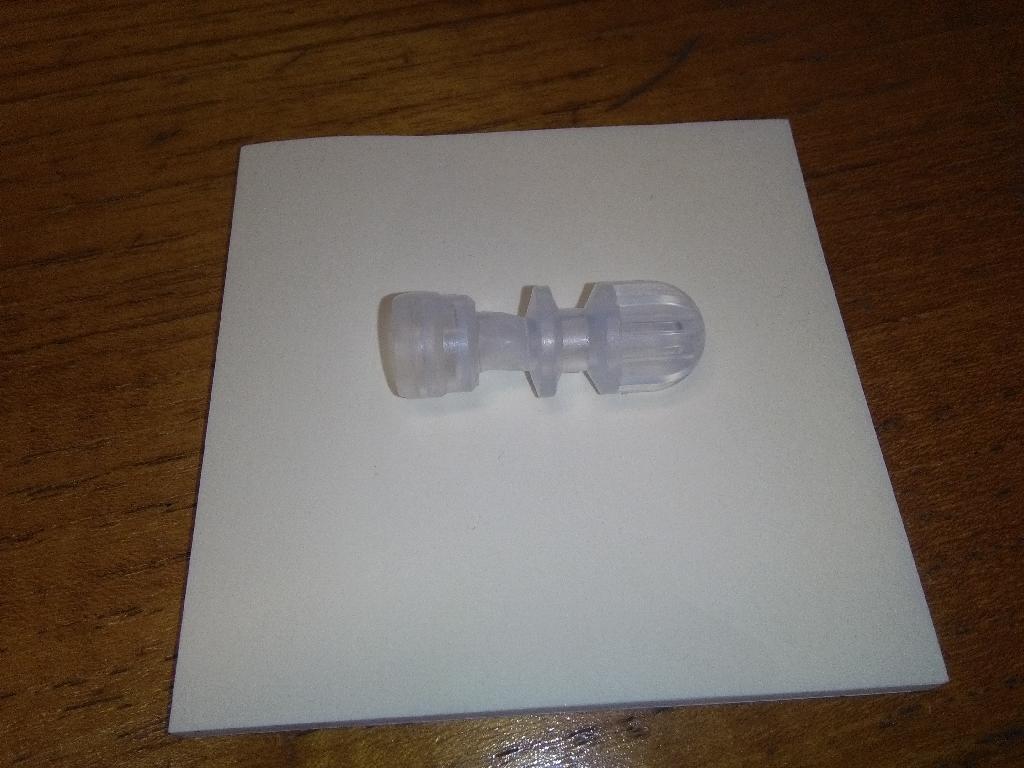 Disconnect cap.  This is a terminating cap which is used with a transfer set for dialysis.  The cap seals the fluid path of the transfer set, keeping the fluid path sterile and preventing contamination.