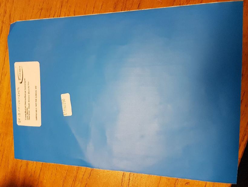 SELF-ADHESIVE FILM OF PLASTIC. THE ROLL WIDTH AT THE POINT OF IMPORT IS 75CM.
THE SELF-ADHESIVE FILM IS USED IN THE MANUFACTURE OF FINISHED SELF-ADHESIVE WOUND DRESSING PUT UP FOR RETAIL SALE.
THE FILM COMPRISES A POLYURETHANE LAYER COATED ON ONE SIDE WITH A COLORLESS SOFT SILICONE ADHESIVE GEL AND A BLUE POLYETHYLENE LINER AND ON THE OTHER SIDE WITH A CAST PAPER LINER.