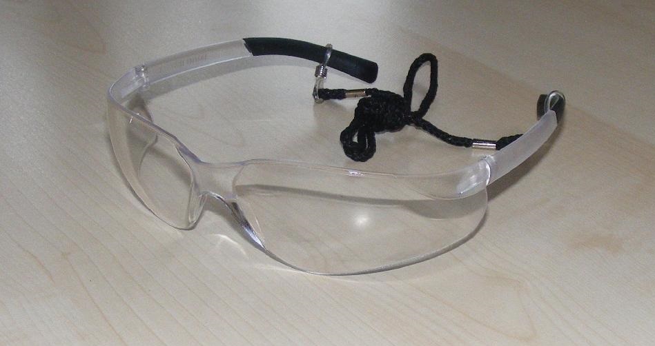 SAFETY GOGGLES. 

THEY INCLUDE A CLEAR, ANTI-MIST  LENS AND COME EQUIPPED WITH A LANYARD.
THEY ARE USED TO PROTECT THE EYES AND THE LENS ARE MADE FROM PLASTIC (POLYCARBONATE).