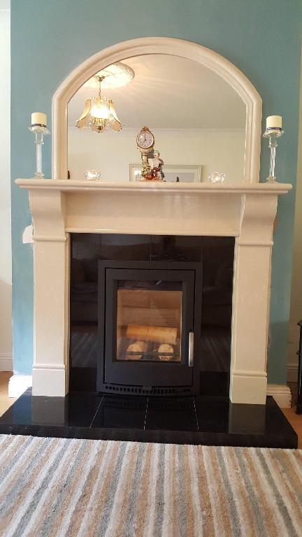 Tara Fireplace. Micro Cream Granite. No Carving on Fireplace.