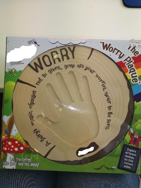 Interactive Worry Plaque made from plastic.  Lights up when child places hand on the plaque.  Battery operated (Batteries not included).  Comes with instructions and two screws for wall mounting.