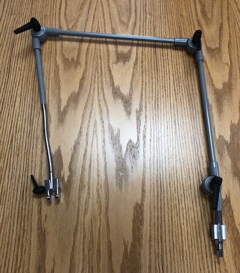 FLEX ARM FOR ATTACHMENT TO A VENTILATOR. 

IT IS PRESENTED UNASSEMBLED AND CONSISTS ESSENTIALLY OF A ROTATING FLEX ARM WITH FLEXIBLE TUBE, 2 FLEX ARM SHAFT ASSEMBLIES, SMALL AND LARGE BUTTON HEAD HANDLES AND ASSOCIATED FRICTION RING, NUTS BOLTS AND WASHERS.
ONE END OF THE FLEX ARM IS EQUIPPED WITH A CLAMP FOR HOLDING THE TUBING FROM THE VENTILATOR WHILE THE OTHER END CONTAINS A BASE ARM ASSEMBLY FOR FITTING DIRECTLY ONTO THE VENTILATOR UNIT. THE FLEX ARM SUPPORTS AND HOLDS TUBING SECURELY FROM THE VENTILATOR TO THE PATIENT SO THAT DAMAGE TO, OR UNWANTED DISCONNECTION OF, THE TUBING IS AVOIDED.
THE VARIOUS COMPONENTS OF THE FLEX ARM ASSEMBLY ARE MADE FROM ALUMINIUM, STEEL AND PLASTIC.