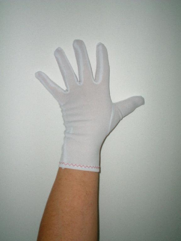 A glove made from 100% knitted nylon. The glove is hemmed at the cuffs with decorative stitching. The glove is unlined and is available in a variety of sizes and different weights.