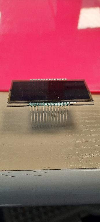 LIQUID CRYSTAL DISPLAY MODULE. 

THIS IS A PASSIVE MATRIX LCD DISPLAY MODULE. THE MODULE CONSISTS OF A LIQUID CRYSTAL LAYER SANDWICHED BETWEEN TWO SHEETS OF GLASS AND DOES NOT CONTAIN ANY ELECTRONIC COMPONENTS OTHER THAN CONNECTING PINS.
IT IS USED IN THE CENTRAL CONSOLE OF A CAR TO DISPLAY AIR CONDITIONING INFORMATION.