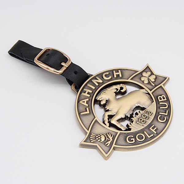 It is a souvenir Golf Bag Tag with a logo which will hang from a golf bag made from Base metal