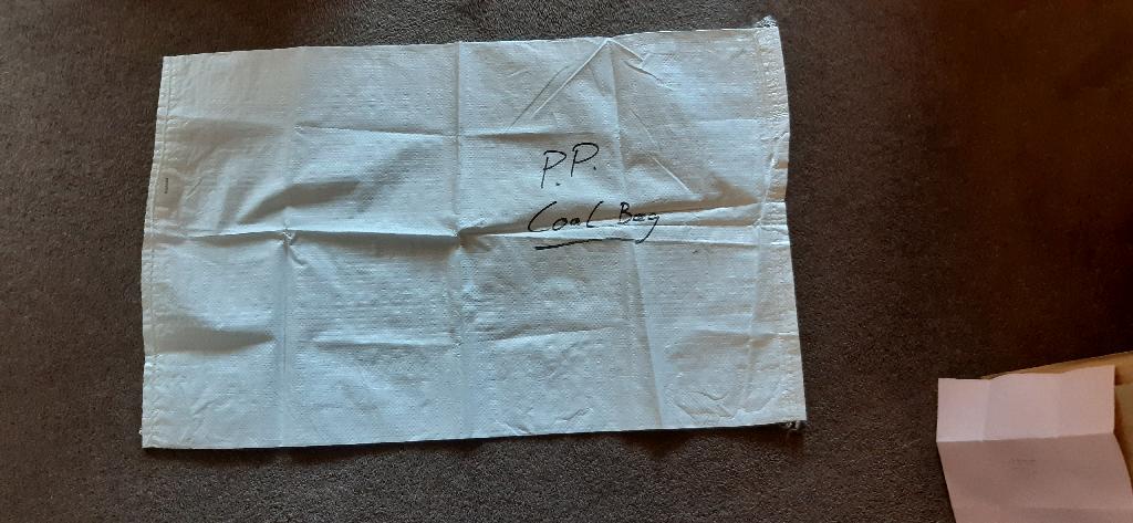 Bag made from Polypropylene/coal bag.
Made from a strip with a width of less than 5mm as per applicant declaration.  Woven.