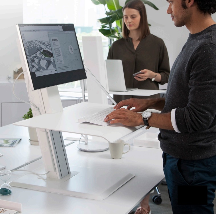 Desk Attachment. 

It sits on a desk and is available in laptop, single or dual monitor configurations. The unit can be adjusted up and down via a spring & pulley mechanism to turn any workspace into a sit/stand arrangement. It includes a self-locking mechanism for stability. 

Conversion kits are available to retrofit the unit from one of the previously mentioned configurations.
It can support up to 16kg and it is made from plastic, MDF, Steel & Aluminium.