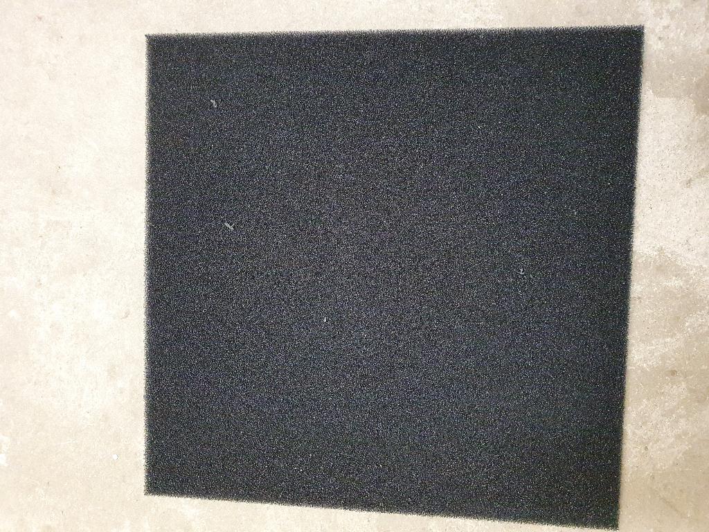 An article of urethane foam, measuring 24" x 24" x 0.75", completely coated with carbon fibres
The carbon fibres give the product its insulation properties. It is used to absorb any stray signals in an antenna or telecommunication product. It is a broadband radar absorber.
