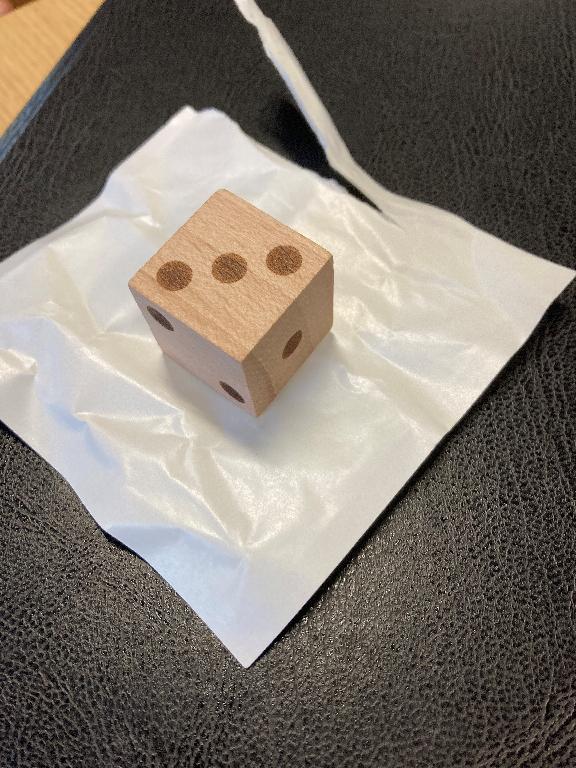 WOODEN DICE MARKED WITH 1,2,3,1,2,3 DOTS.  COMES IN A GLASSINE BAG.  THE PARTS ARE INTEGRAL IN THE PLAYING OF A BOARD GAME.
1000PCS PER CARTON 54.6x 55.9x53.3CM.