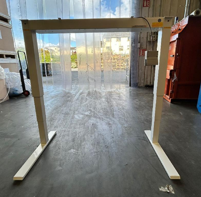 Table base. 

It is a base for a height adjustable office table. It is presented without a top as this is a customisable option in terms of colour, surface area and constituent material.
It is height adjustable from 27” to 47” off the floor and can accommodate a tabletop width range of 48” – 72” and a tabletop depth range of 24” – 30”.
The base is manufactured from steel & aluminium and has no indications of manual work.