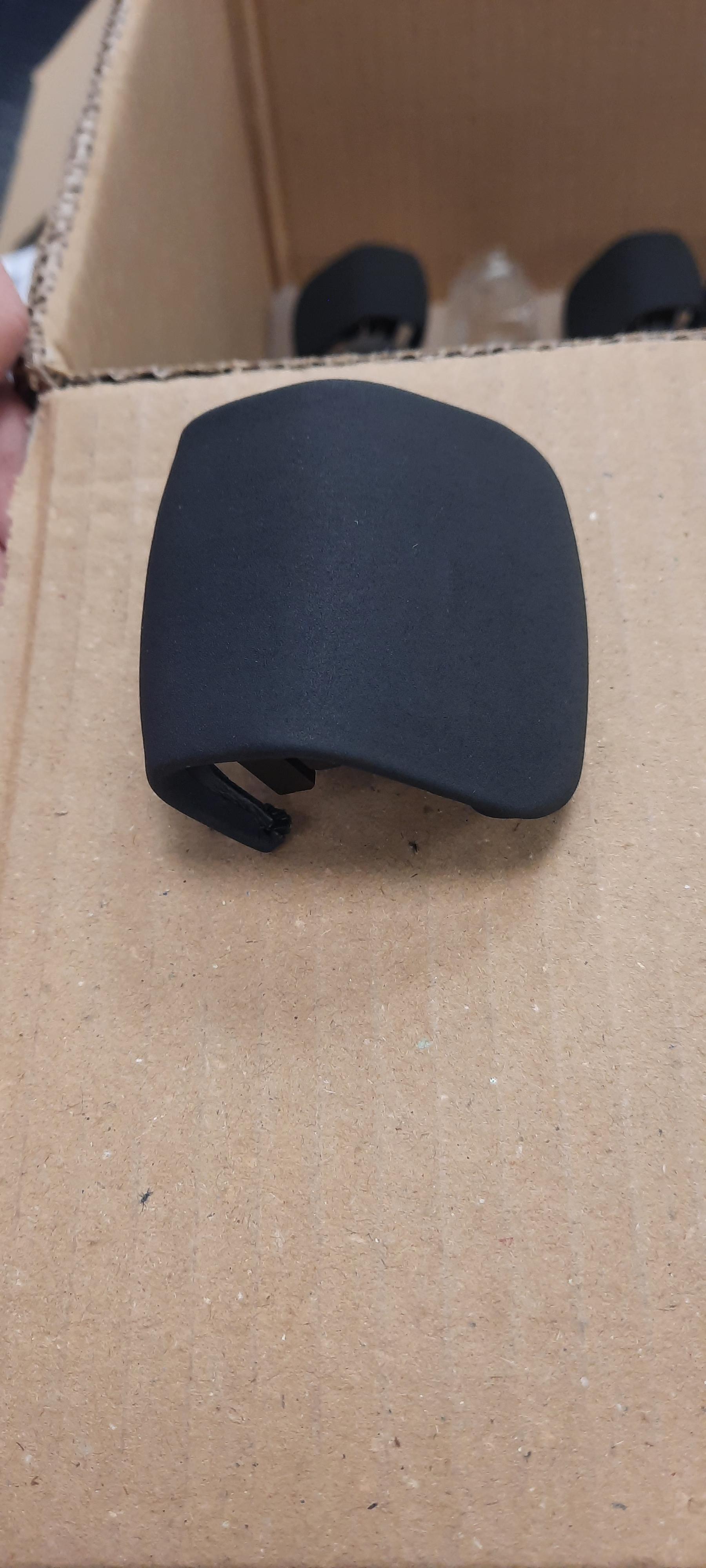 A plastic gear shift knob with a PU Leather covering.
It is the top cover for the automatic gear lever in a car. It allows the driver to grip the gear lever to facilitate changing the gearbox position. While the gearbox could function without the cover, it does provide a comfortable grip and aesthetic finish for the driver
It is comprised of 3 main materials;
PA6 (Polyamide or Nylon 6) with Glass Fibre                 18.6grams

Material 2
TPE (Thermoplastic Elastomer)                                        9.7grams

Material 3
PU leather (Polyurethane Leather)                                   0.0145m2
