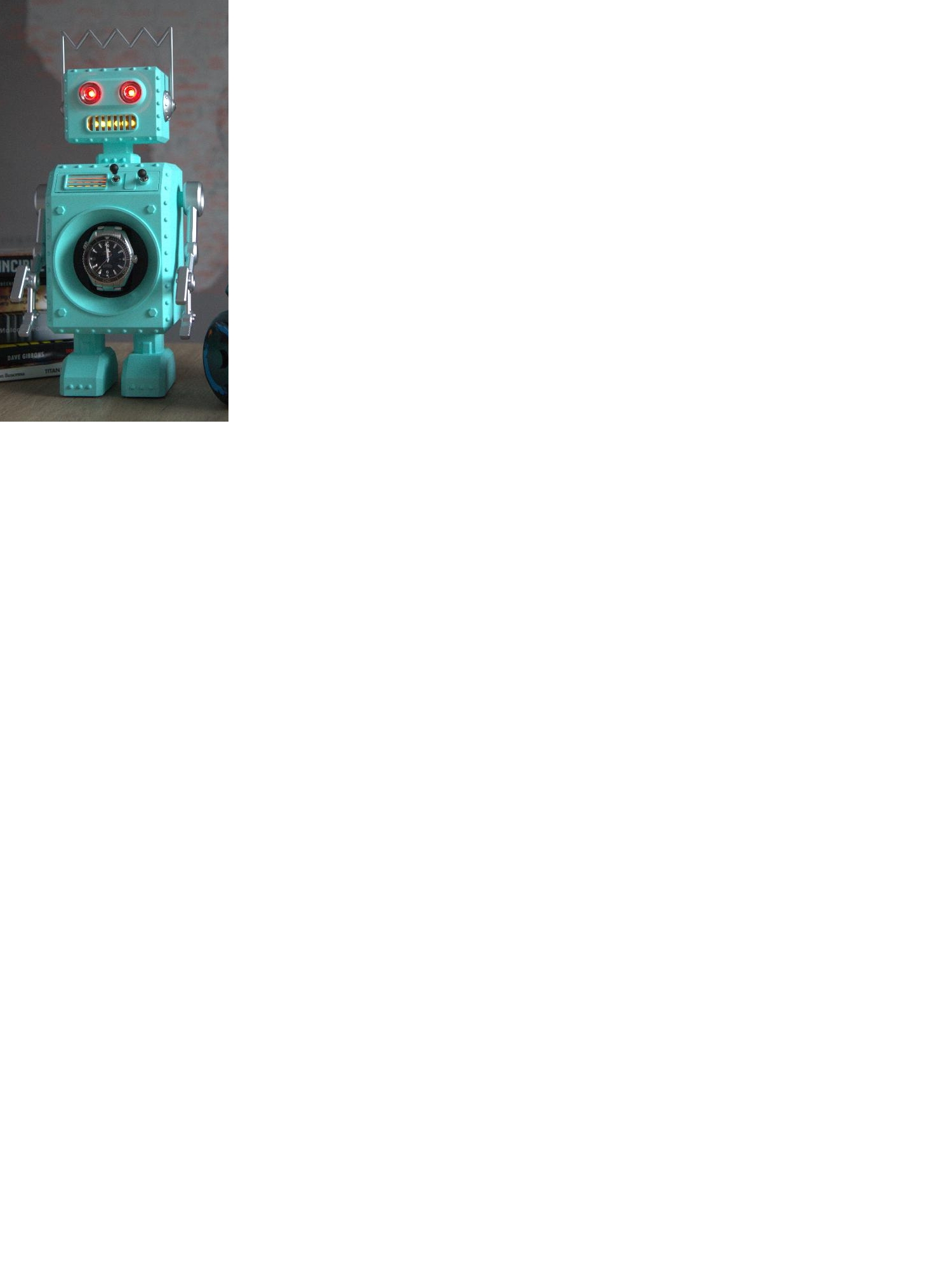 Watch winder which is a device for winding automatic watches.
It is in the design of a robot and made from cast aluminium.
It has an internal plastic winding mechanism, motor, LED lights and batteries.
2.224kg in weight, 165mm wide x 343mm high x 205mm deep.