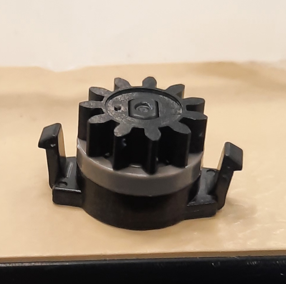 Mechanical movement regulator. 

It is an integral component used in an All-Terrain Control Module “ATCM” (not the subject of this BTI). The ATCM acts as an off-road cruise control for vehicles allowing the driver to set the desired speed and then focus on steering.
The movement regulator is specifically designed for use in the ACTM. In conjunction with an attached spring, the movement regulator dampens movement to provide a smooth operation of the ATCM.
The product is a mechanical assembly and contains four plastic parts (housing, rotor, cap & gear), one rubber part (o-ring) and silicone oil.