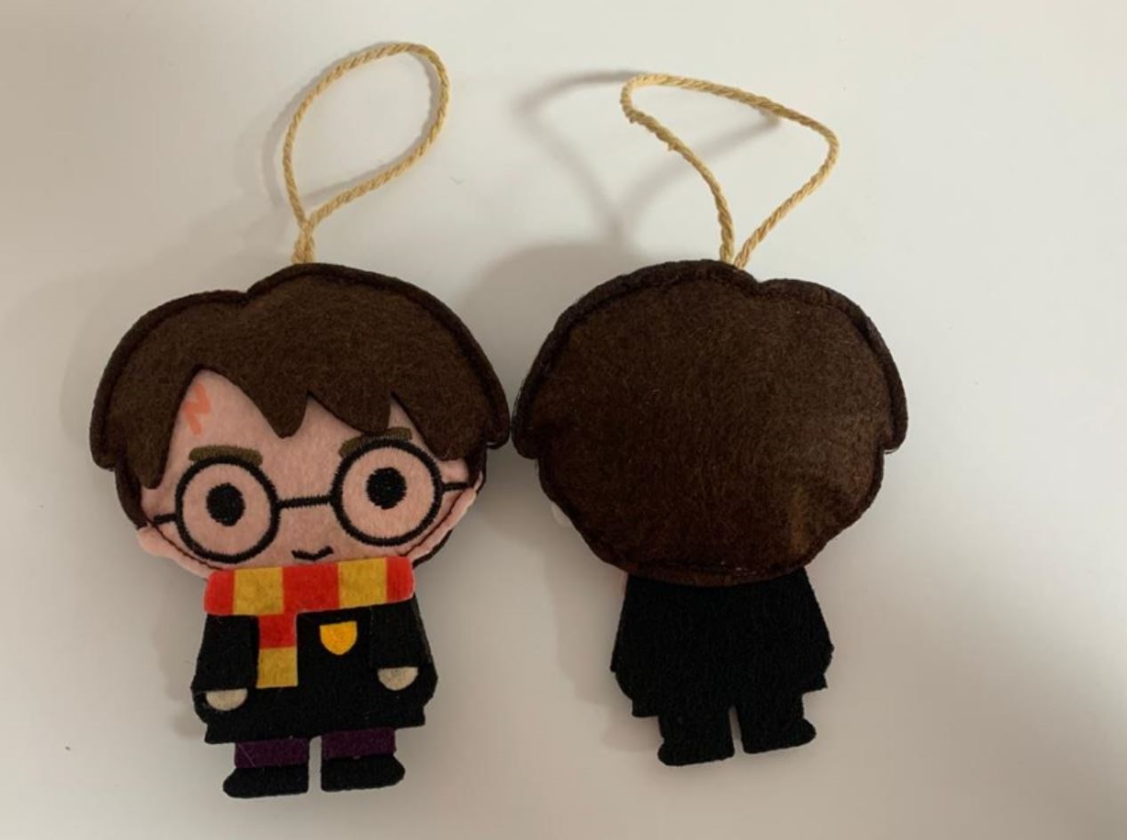 Christmas tree decoration of a well known animation character. Made of felt fabric. The decoration contains a loop and is designed to be hung on a Christmas tree.