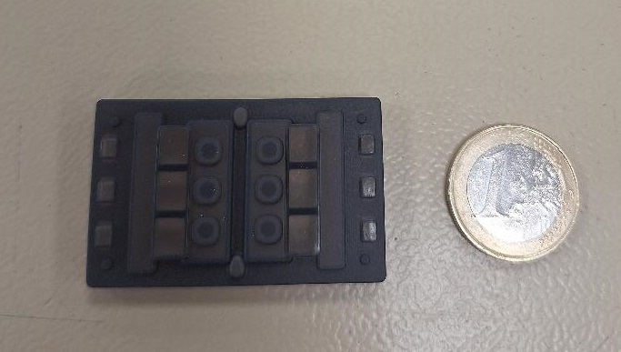 Electrical Insulator. 

It is used in the front control panel of a car to protect external controls of a lock/unlock switch from internal electrical components such as a printed circuit board. It also aids the aesthetic sound of the push function of the switch.
It is a moulded part made of silicone rubber and is specifically designed & shaped.