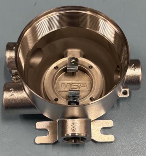 1. Stainless steel X5000 Housing 
2. Circular Housing , with 4 Cable entries , 
     Up to 2 Cable entries can be used to hold accept gas 
     Detector sensors(Not subject to BTI) , the housing has slots to accept the 
     X5000 Electronic control board(Not subject to BTI)
3. Its a metal housing  which has electronic components, 
    sensors and Lid added to manufacture a  complete Gas 
    detector (Electronic components / sensors not subject to BTI)
4. It is Made from 316 Stainless steel
5.  Its a 316 Stainless steel cast which is then machined to 
     exact specifications 
6. it has internal Thread on inside top to accept tread from separate Lid , it has MSA Engraved on it , it has the cable entries numbered and 4 hole slots inside to accept the Electronic components
Housing
Cast stainless steel