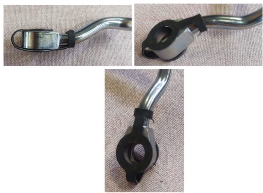 Guarnizione metallo-plastica.
Articolo costituito da un doppio anello a tenuta stagna a doppia guarnizione comprendente 2 elementi di supporto: una prima linguetta, larga 5 mm, che collega i 2 anelli e una seconda linguetta, larga anch’essa 5 mm, congiunta a un anello e a forma di “T”, che serve al fissaggio del ns. articolo al raccordo ad occhio con cui si accoppia.
Anelli ed elementi di supporto hanno uno spessore di 1 mm a comporre il quale vi è un’anima metallica ricoperta su entrambi i piani da uno strato di rivestimento costituito da un elastomero nitrilico rivestito in grafite. Il diametro esterno degli anelli è pari a 19,2 mm, mentre il diametro interno è pari a 11,2 mm per l’anello dotato di appendice a “T” e 10,1 mm per l’altro anello.
Materiale
-	Anima: Acciaio inox secondo norma SAE J403 (AISI 1008-1010), spessore 0,8 mm
-	Rivestimento: elastomero nitrilico rivestito in grafite e composto di fibre secondo norma AST F104. Spessore 0,1 mm.
L'articolo viene assemblato sul raccordo ad occhio e serve a impedire le fuoriuscite di olio, nonché a evitare contaminazioni dall’ambiente esterno assicurando la tenuta stagna delle superfici che va a congiungere.