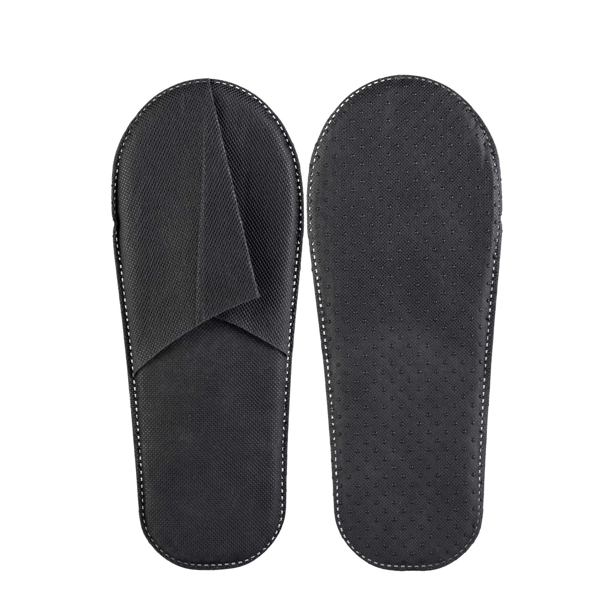 Pantofola da camera con tomaia e suola in TNT di materiale sintetico, con presenza di gommini antiscivolo in PVC sulla suola.