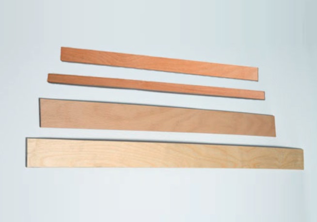 Doghe in legno.
La merce è  destinata  ad essere montata  su telai di  letti, divani, poltrone etc..
Le doghe sono realizzate in legno di faggio o di  betulla stratificato, incollato, sfogliato, derullato.
Le doghe possono essere curve o, a seconda del modello, dritte. dimensioni:  lunghezza da 484mm a 1959mm, larghezza da 25mm a 2015mm, altezza da 8mm a 12mm.
Le doghe si presentano stondate ai lati e curvate dal centro all'estremità.