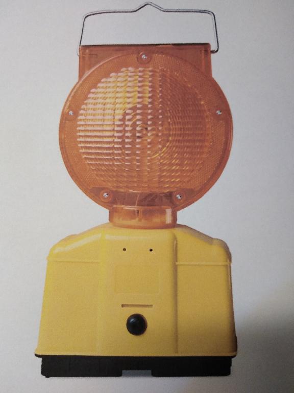 As per information provided it is a portable article.
Used as warning light, fitted with leds and battery.  Self charging with fitted solar panel.
In a plastic housing.