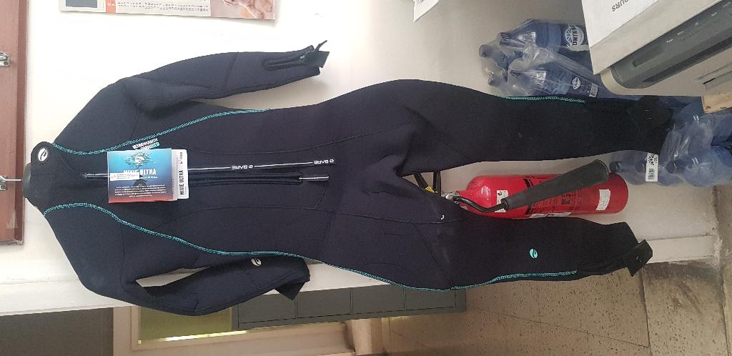 As per description and sample provided - Ultra full wetsuit.
It is used for diving.
Wet suit is made of neoprene and covered on both sides with knitted nylon fabric.  It has a small zipper at the front, other long zipper at the back and flex kneepads.