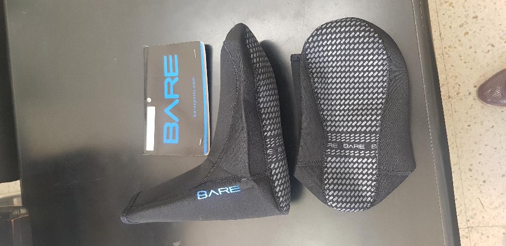 As per description and sample provided; 2mm Neoprene Socks that come with non-slip screen printed dots on the sole. 
Made of Neoprene and covered on both sides with knitted nylon textile material.
It is used by divers