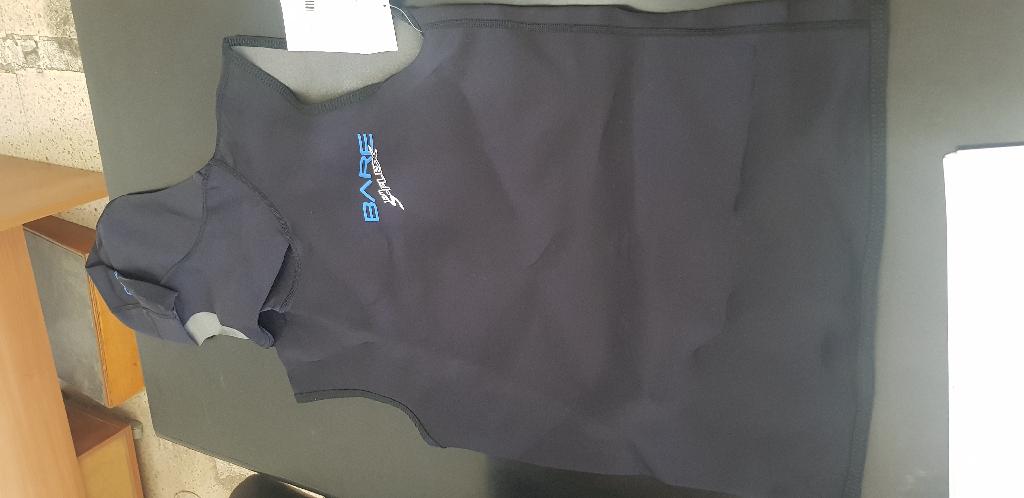 As per sample and description provided - 1mm hooded vest without arms, covering only front and back of the body.  It is entirely made of neoprene having the outer layer covered with knitted nylon textile material.
Hooded vest is used by divers